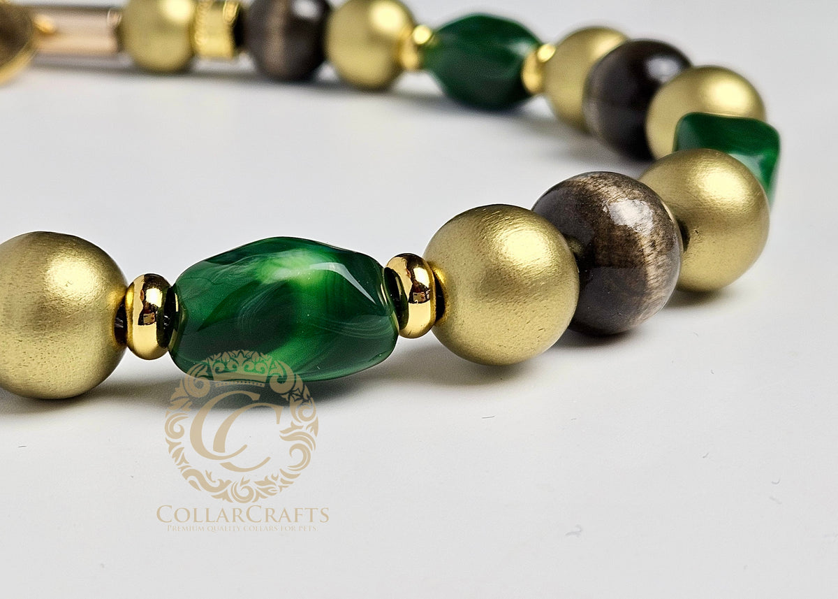Luxury emerald green beaded dog collar closeup with gold hardware and wooden beads, handmade designer dog collar by CollarCrafts for dogs of all sizes 