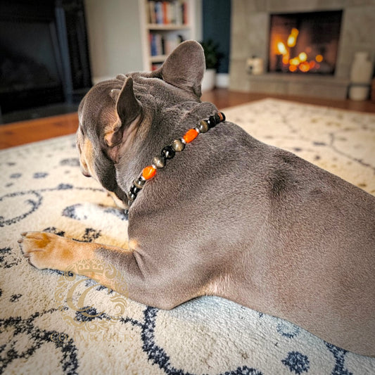 French Bulldog Maurice with a CollarCrafts dog collar Noir Ember in an cozy home setting with a fireplace in the background